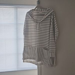 A throw over light sweater with mid length sleeves and low/ high length.
